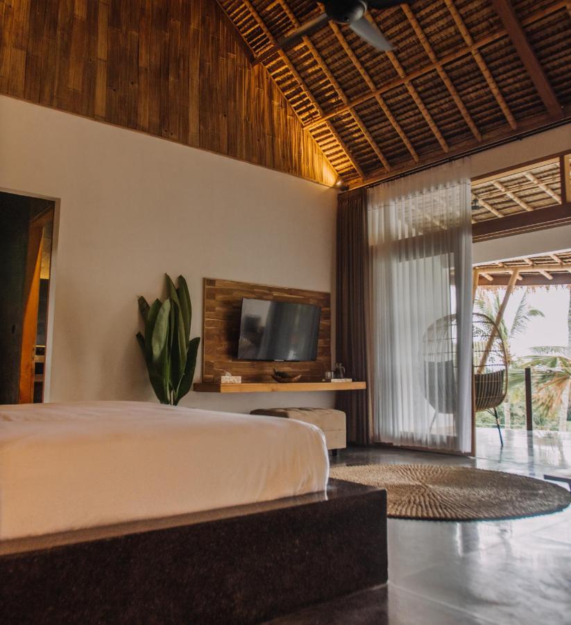 Neano Escape Manggis Exterior foto A bedroom at the resort