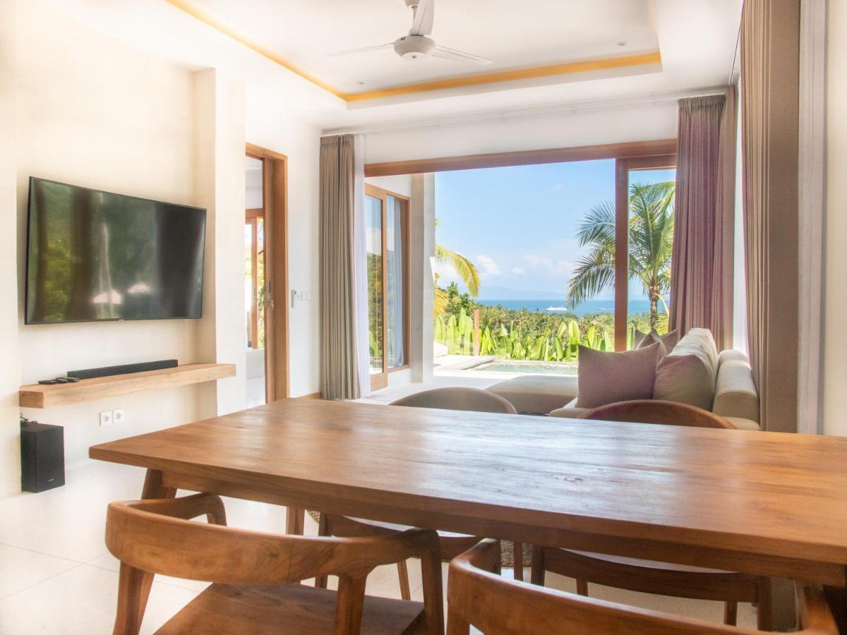 Neano Escape Manggis Exterior foto Living room at the Beachfront Pool Villa